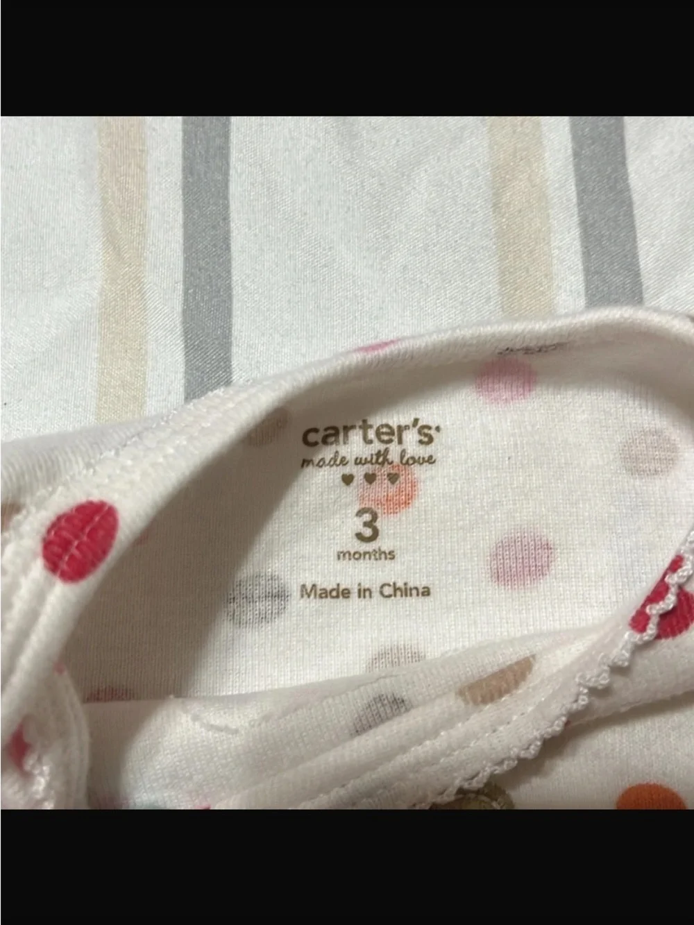 Carter's Polka-Dot long sleeved onesie with flower on chest, snaps